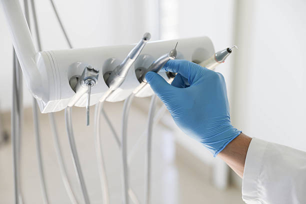 Professional Tooth Extraction technician working in Lenawee County County, MI